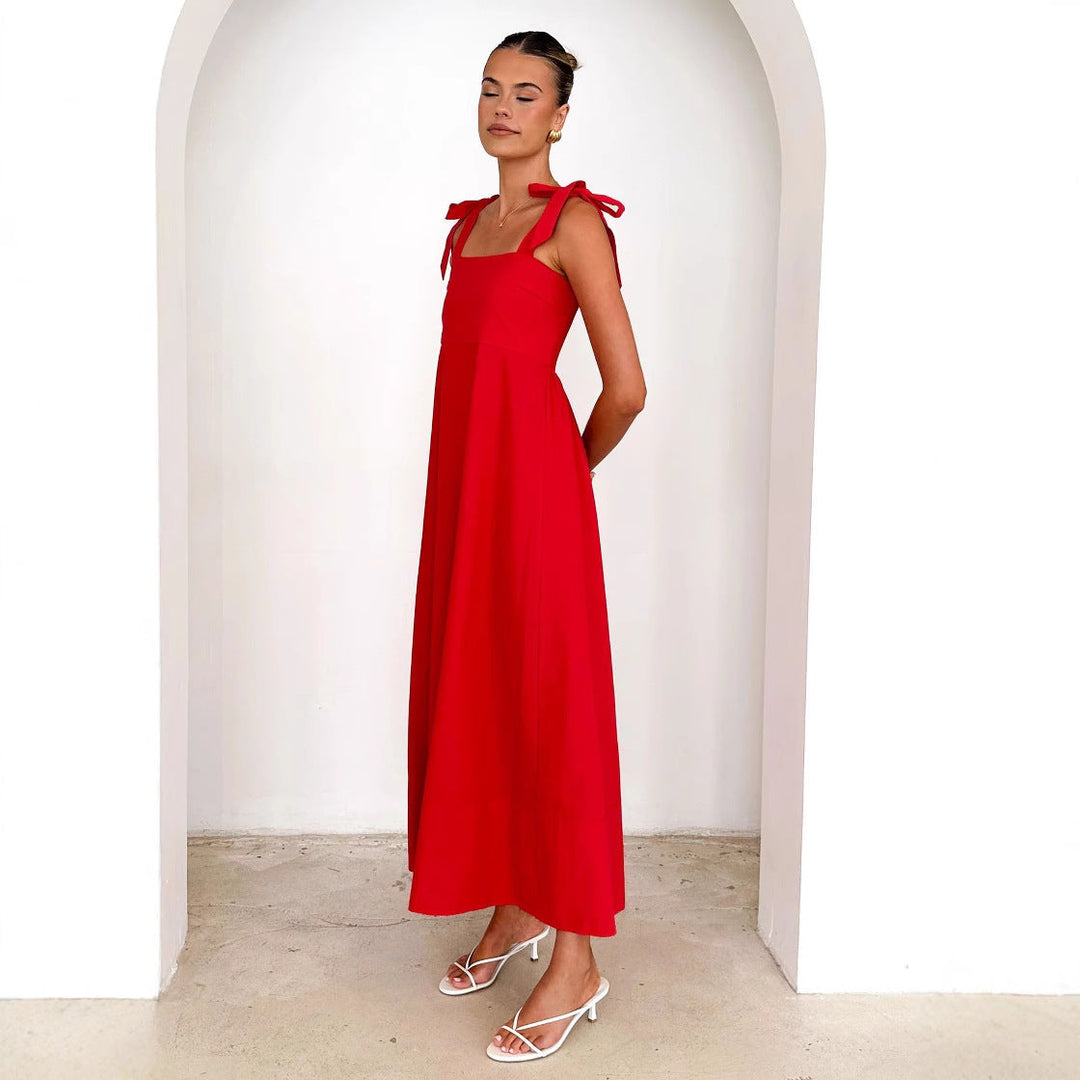Flowy red women's maxi dress with adjustable straps, ideal for summer events & beach vacations.
