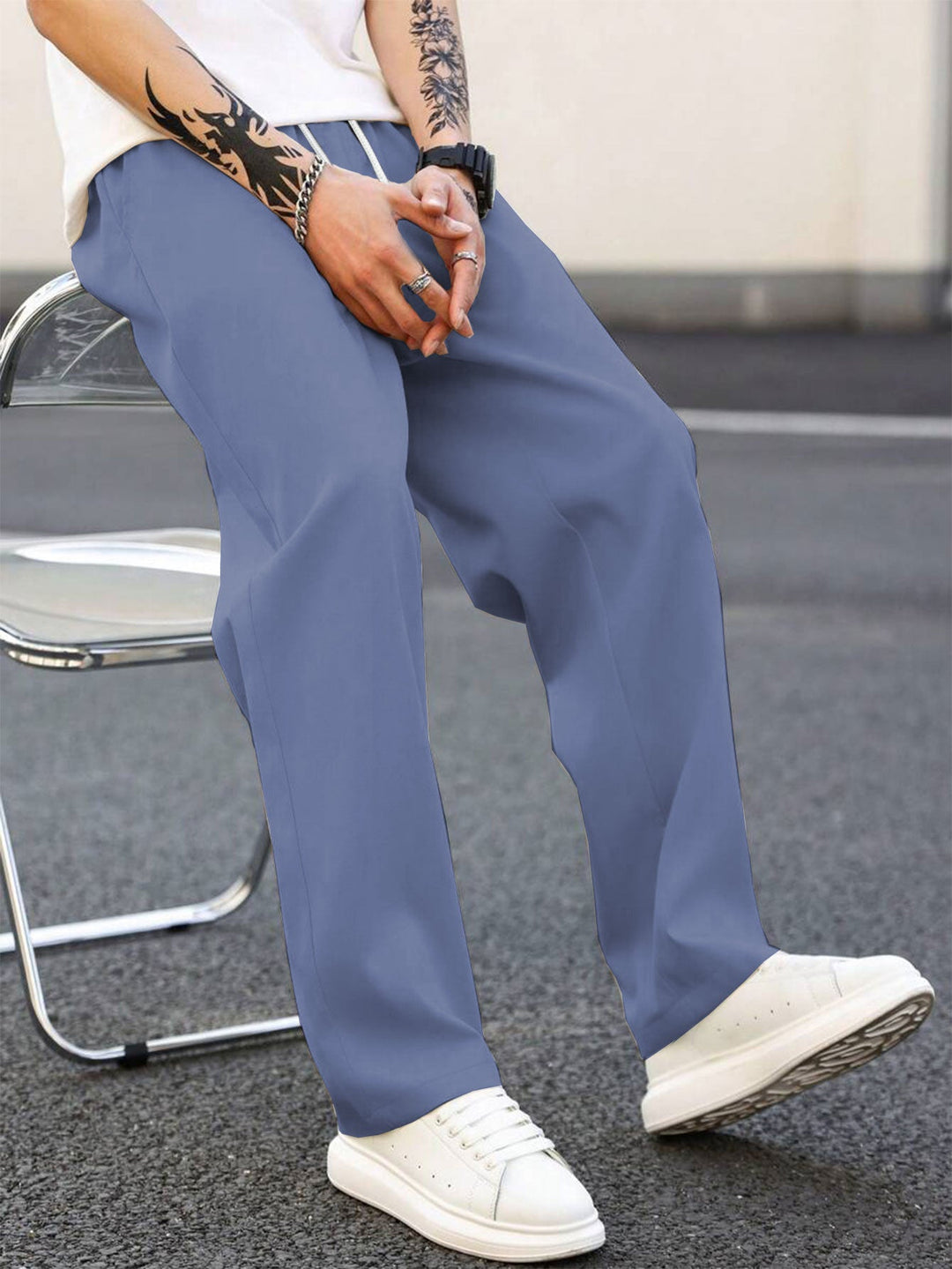 Back view of men's loose fit leisure pants. Elastic waist ensures a comfortable and relaxed fit.