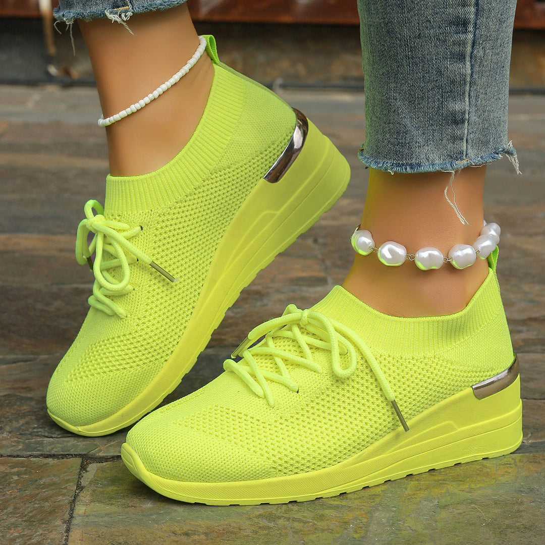 Women's active wear platform sneakers, offering secure fit, comfort, and style for daily activities.