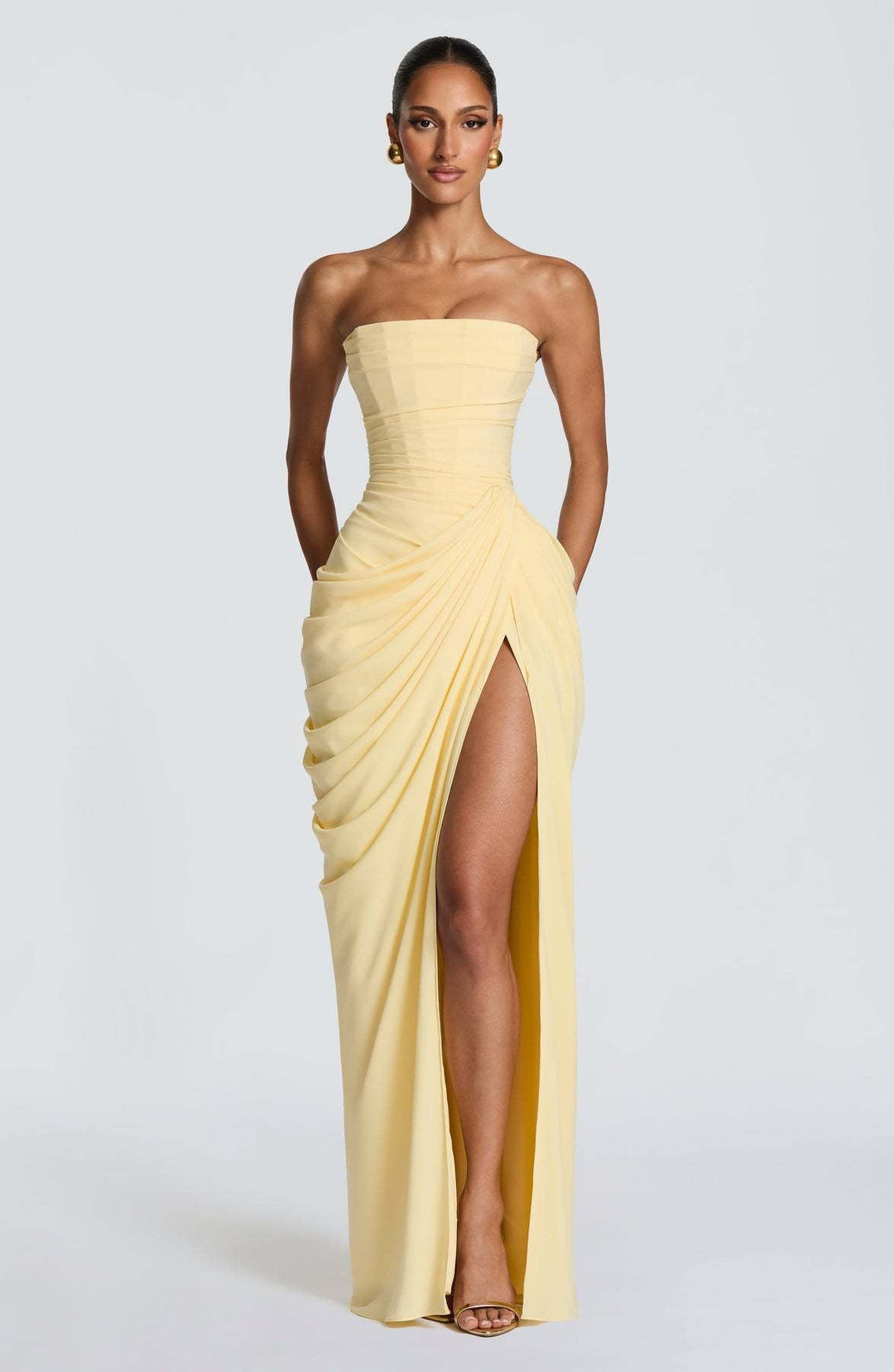 Chic women's draped maxi dress with long sleeves and a sophisticated slit, ideal for elegant evening wear.