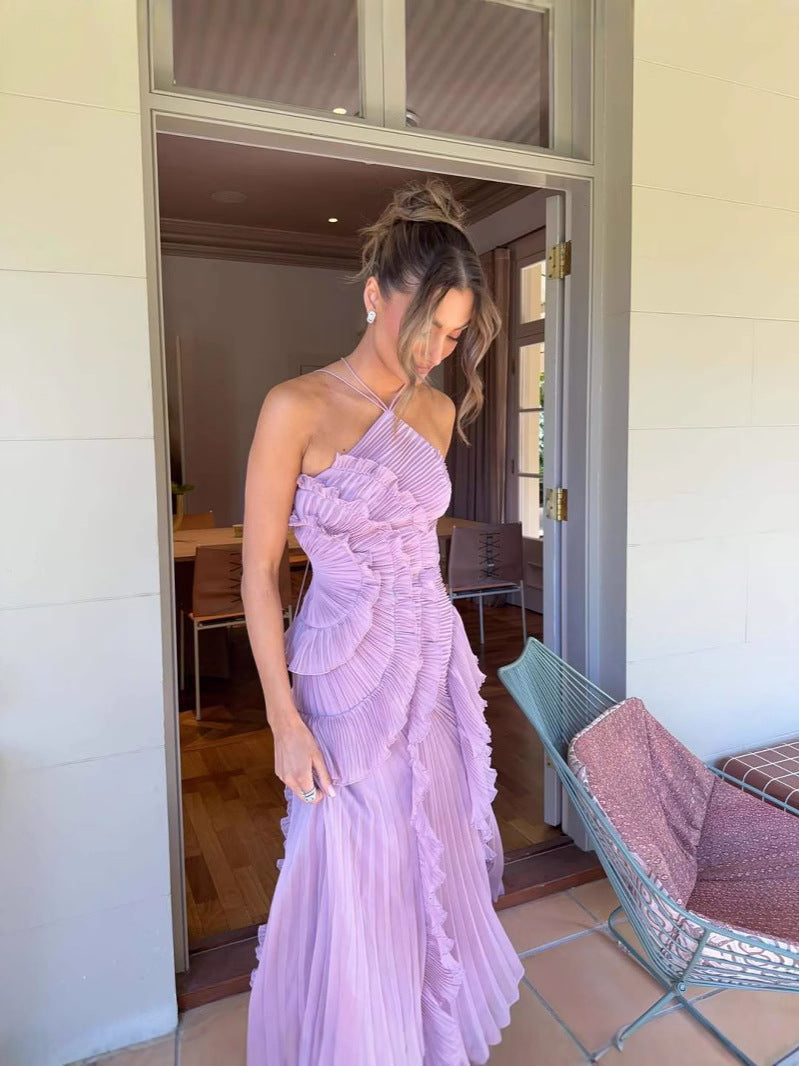 Charming purple flowy ruffle dress for women, ideal for elegant occasions. Sleeveless design.