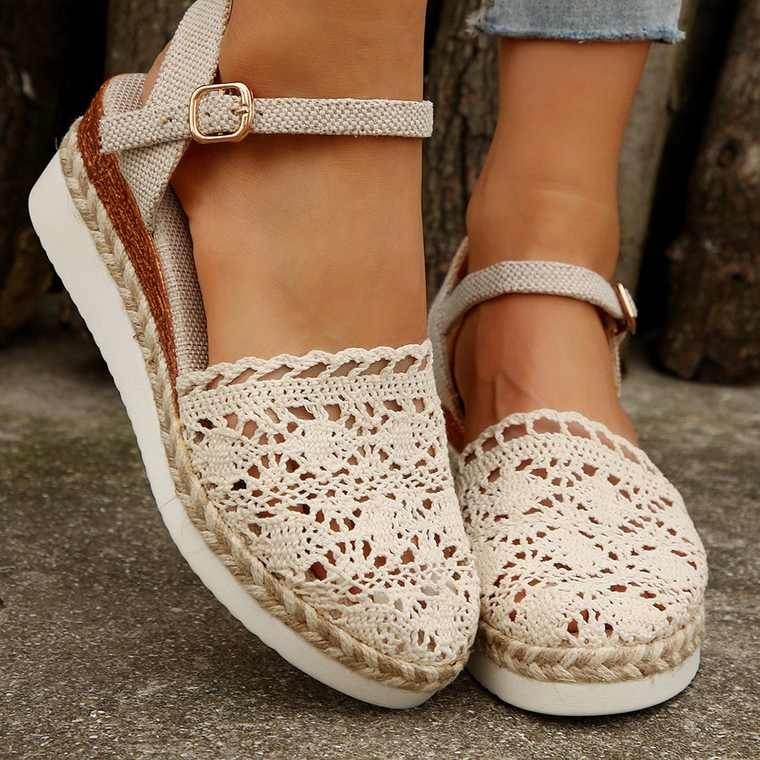 Violet ankle strap espadrille sandals, offering comfortable and stylish casual footwear for summer days.