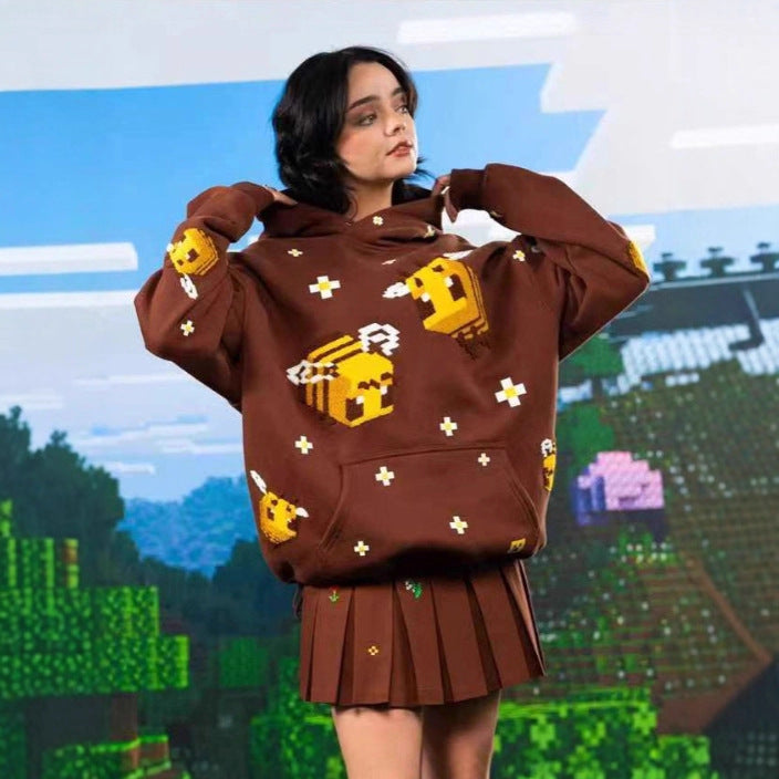 Comfortable women's light brown hoodie with a charming bee graphic, ideal for casual fashion and streetwear.