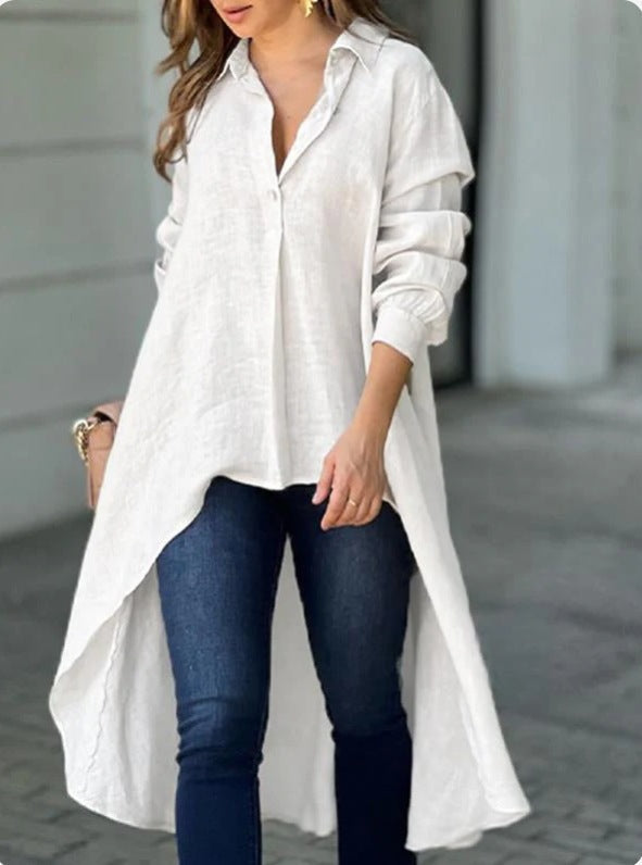 Model wearing a women's casual white long blouse, comfortable relaxed fit for summer strolls.