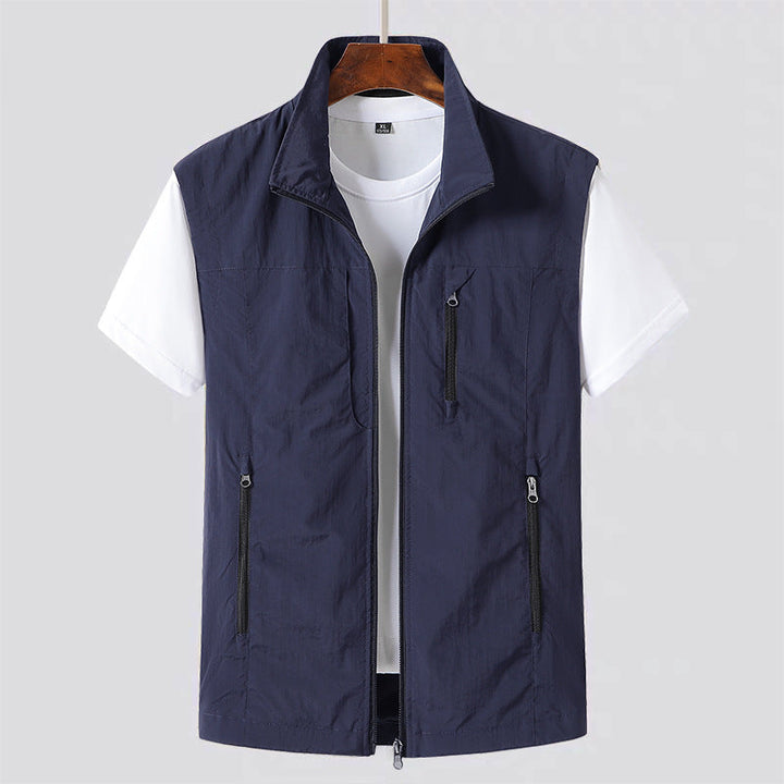 Men's lightweight zip front gilet. Practical utility vest for layering, ideal as a casual or travel sleeveless jacket.