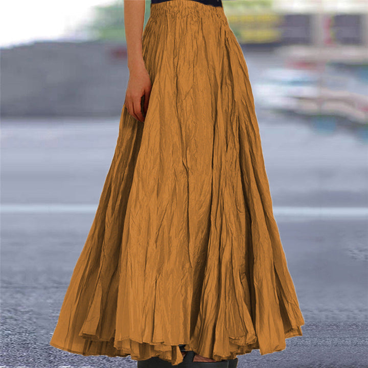 Women's pleated flowing maxi skirt with elastic waist for comfort and a chic A-line fit.