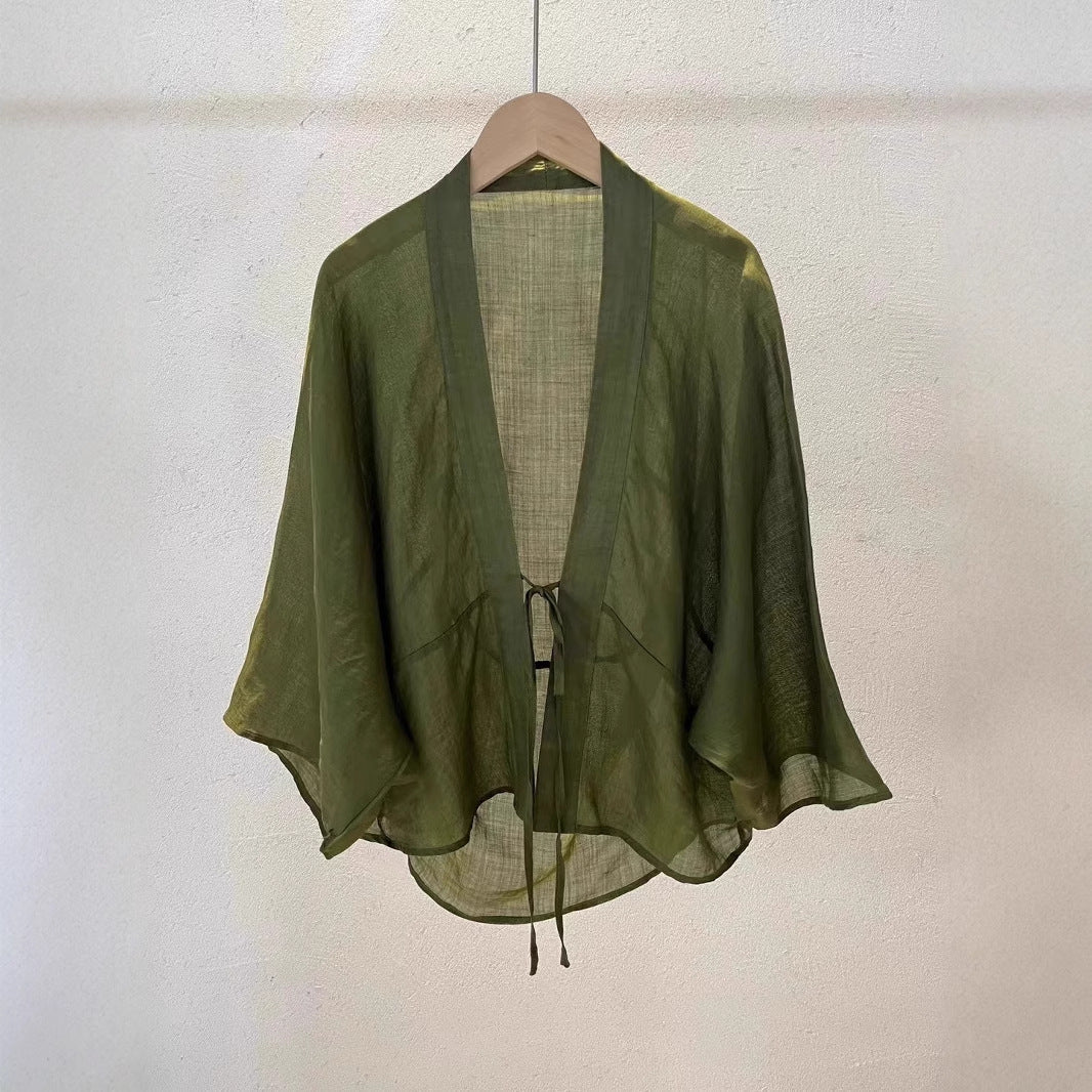 Fashionable sheer wrap top for women, a chic and lightweight cardigan for effortless style and layering.