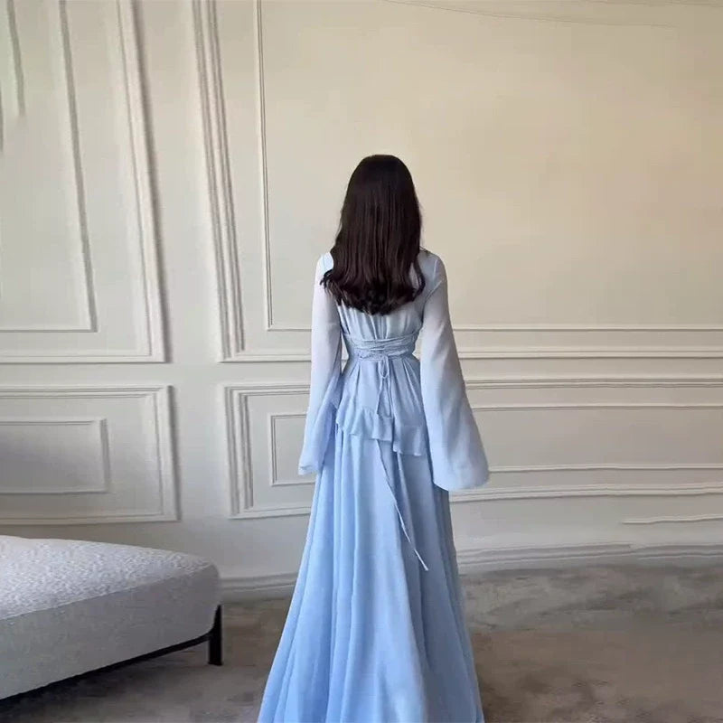 Sophisticated women's maxi dress featuring a tiered skirt and elegant flowing bell sleeves.
