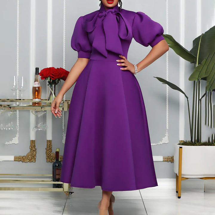 Elegant women's maxi dress with voluminous puff sleeves, a stylish bow neckline, perfect for formal occasions.