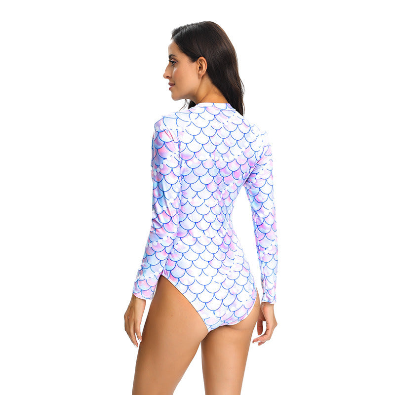 Close-up of women's long sleeve zip swimsuit, showcasing UV protection fabric & flattering fit.