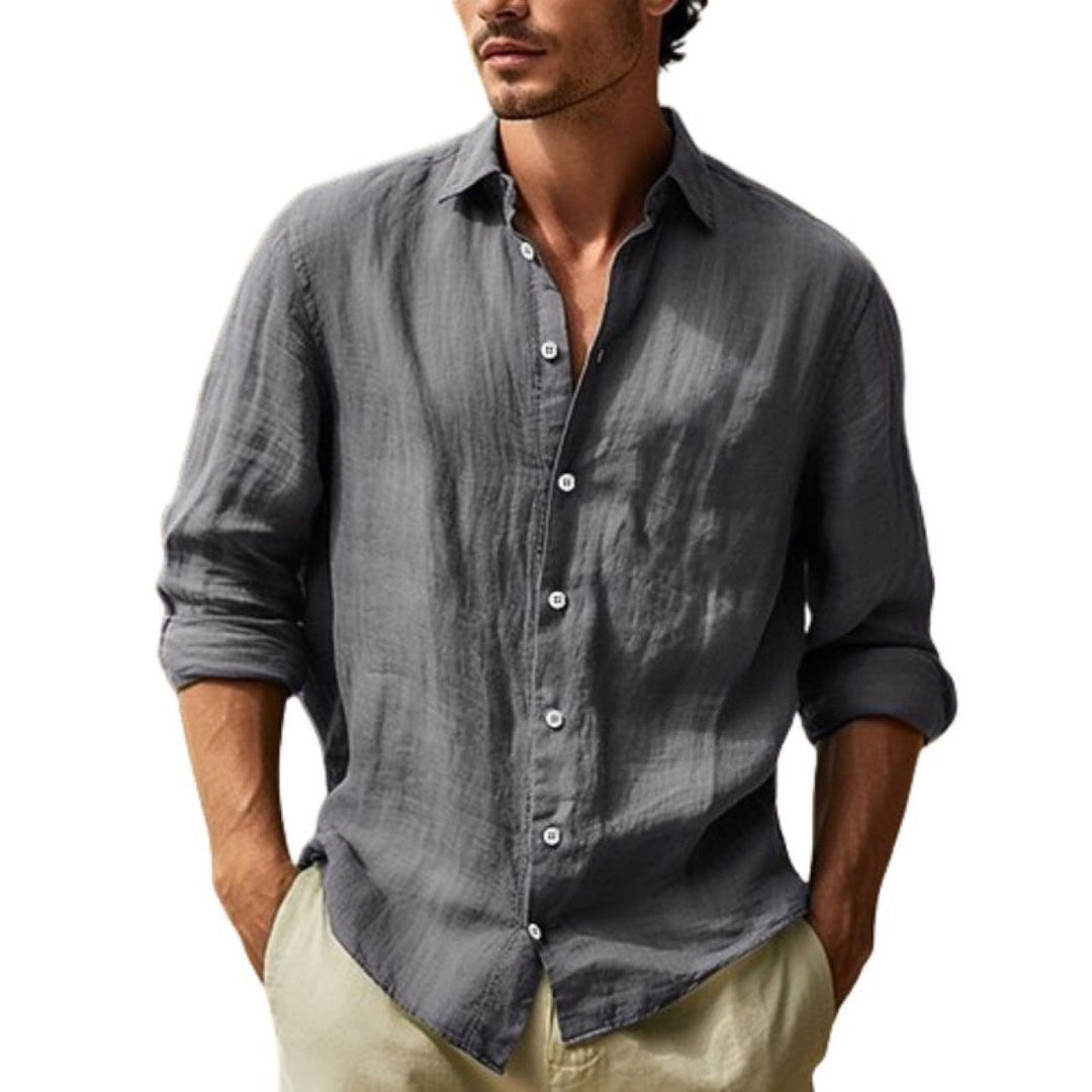 Relaxed fit men's button-up shirt, lightweight and breathable short-sleeve top for summer comfort.
