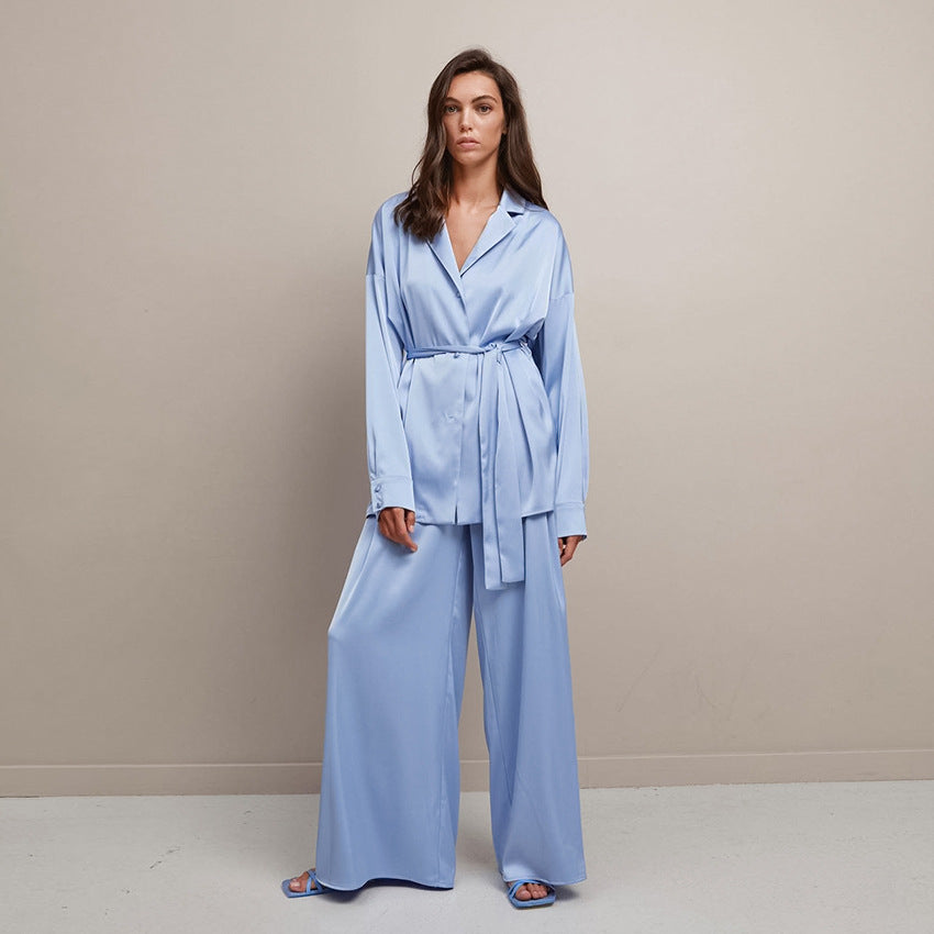 Comfortable loose fit two-piece suit for women, featuring a stylish blouse and trousers set.