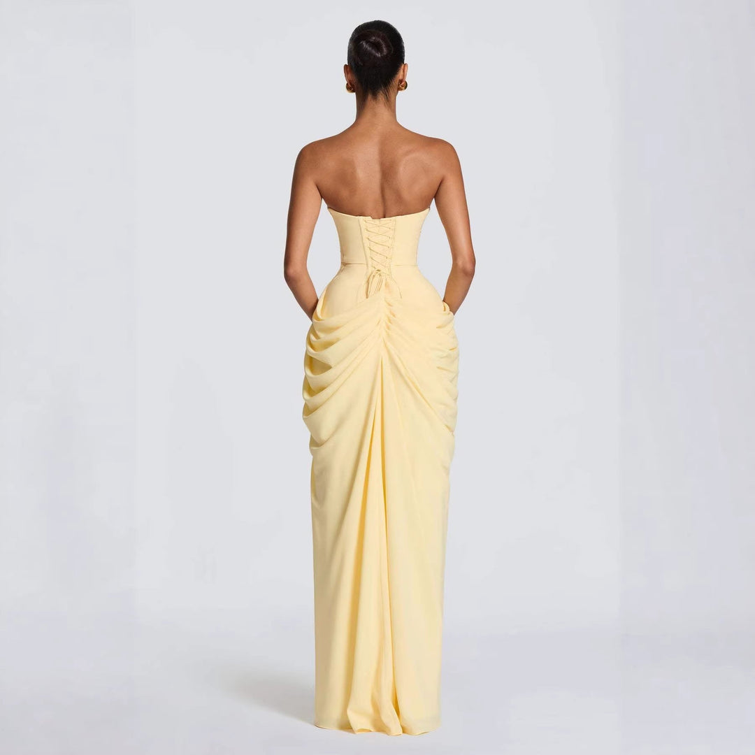 Women's elegant evening gown, full-length with long sleeves, delicate draping, and a flattering side slit.