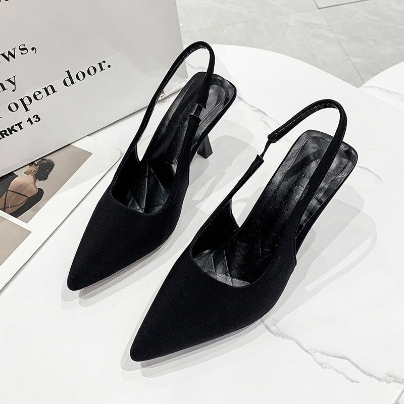 Women's fashion black pointed-toe slingback heels, versatile for formal and everyday comfort.