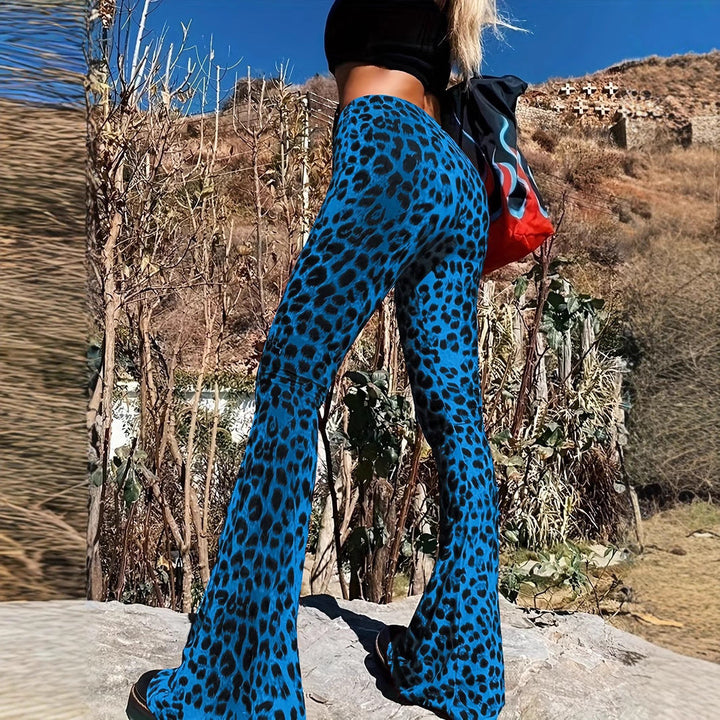 Close-up of trendy leopard print on women's flared pants, highlighting chic animal print detail.