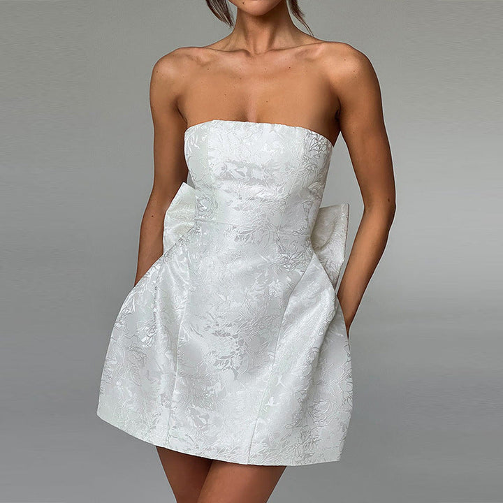 Sleek strapless A-line mini dress, an elegant women's party gown. Ideal for formal & cocktail events.