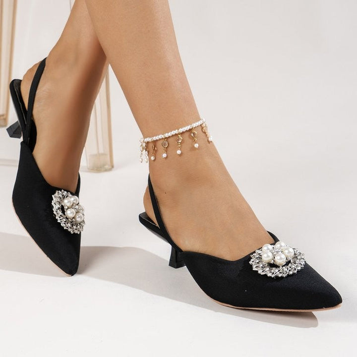 Women's sophisticated pointed-toe slingback pumps with delicate pearl accents and comfortable high heel.