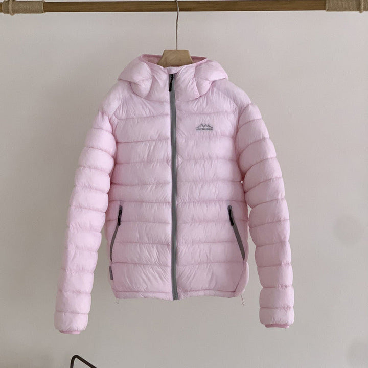 Versatile women's ultralight puffer jacket, packable with removable hood, perfect for casual wear.