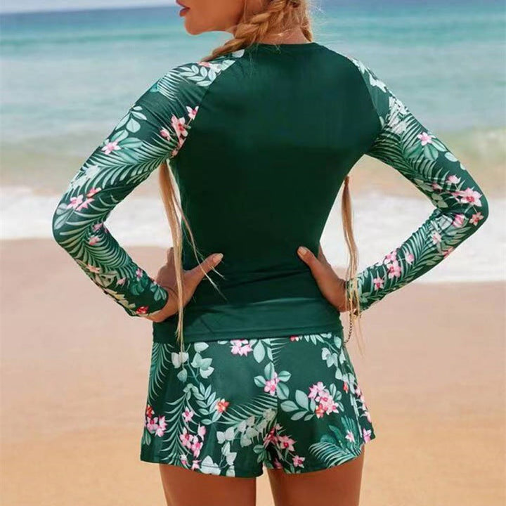 Chic women's UV protection long sleeve surf suit, tropical leaf print, perfect for summer fashion.