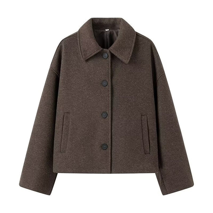 Women's elegant cropped jacket. Stylish long-sleeve button-front, perfect for versatile & chic transitional outerwear.