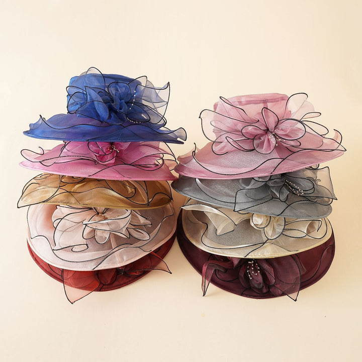 Wide brim women's elegant mesh sun hat with a romantic bow, offering stylish sun protection.