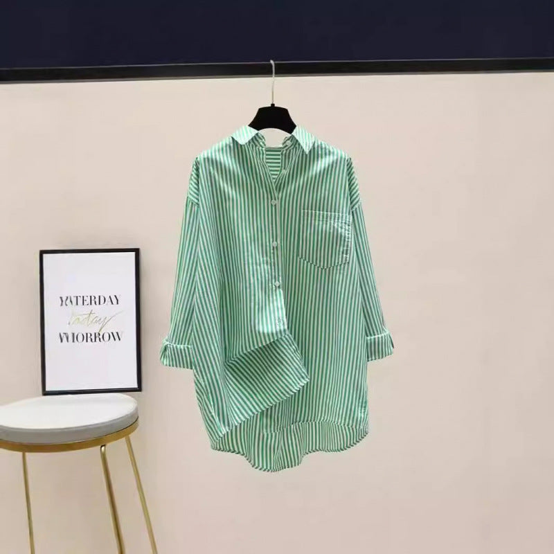 Comfortable women's oversized striped shirt, designed with a longer back and functional chest pocket.