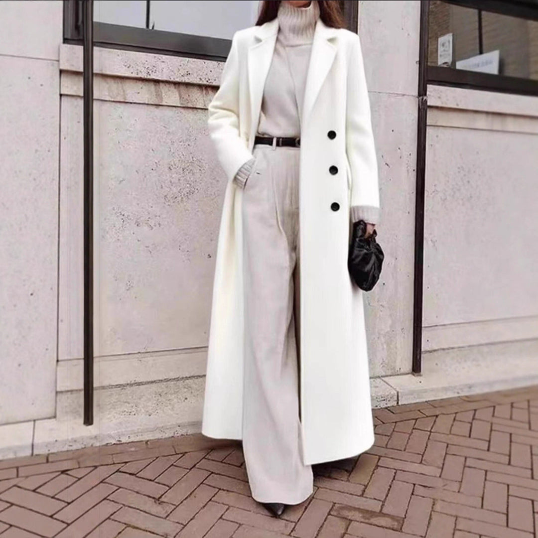 Chic women's double-breasted long jacket, classic style for sophisticated outerwear.