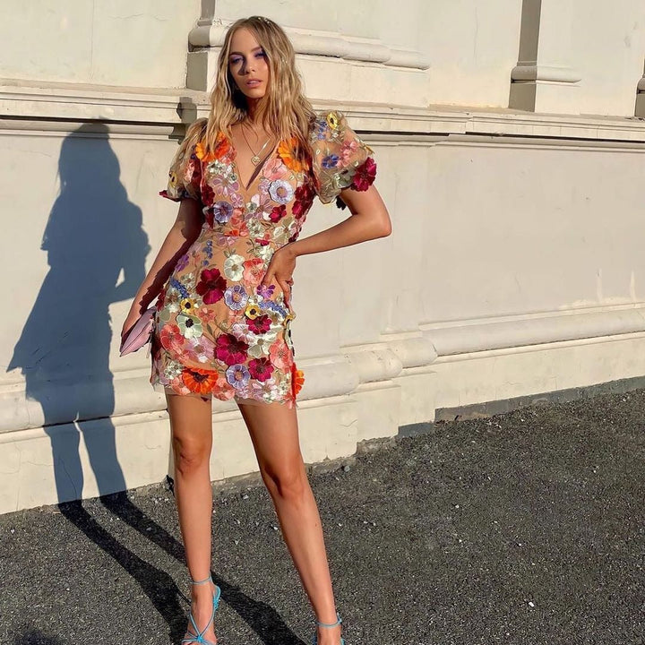 Stunning floral embroidered bodycon dress for women, featuring a flattering midi length and elegant design.