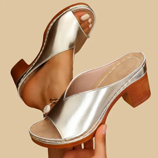 Orthopedic unisex sandals featuring a comfortable chunky high heel & excellent arch support.