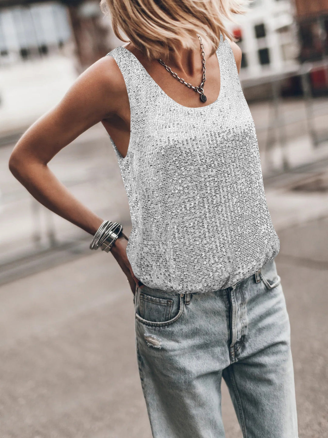 Women's shiny sleeveless top, perfect for glamorous party wear or elegant casual chic outfits.
