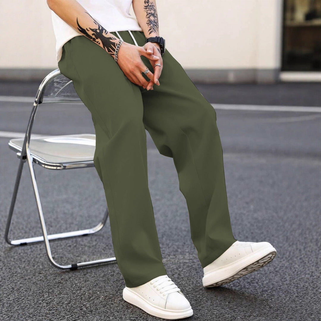 Men's comfortable loose fit leisure pants, elastic waist detail. Perfect for relaxed everyday style.