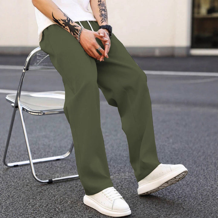 Men's comfortable loose fit leisure pants, elastic waist detail. Perfect for relaxed everyday style.