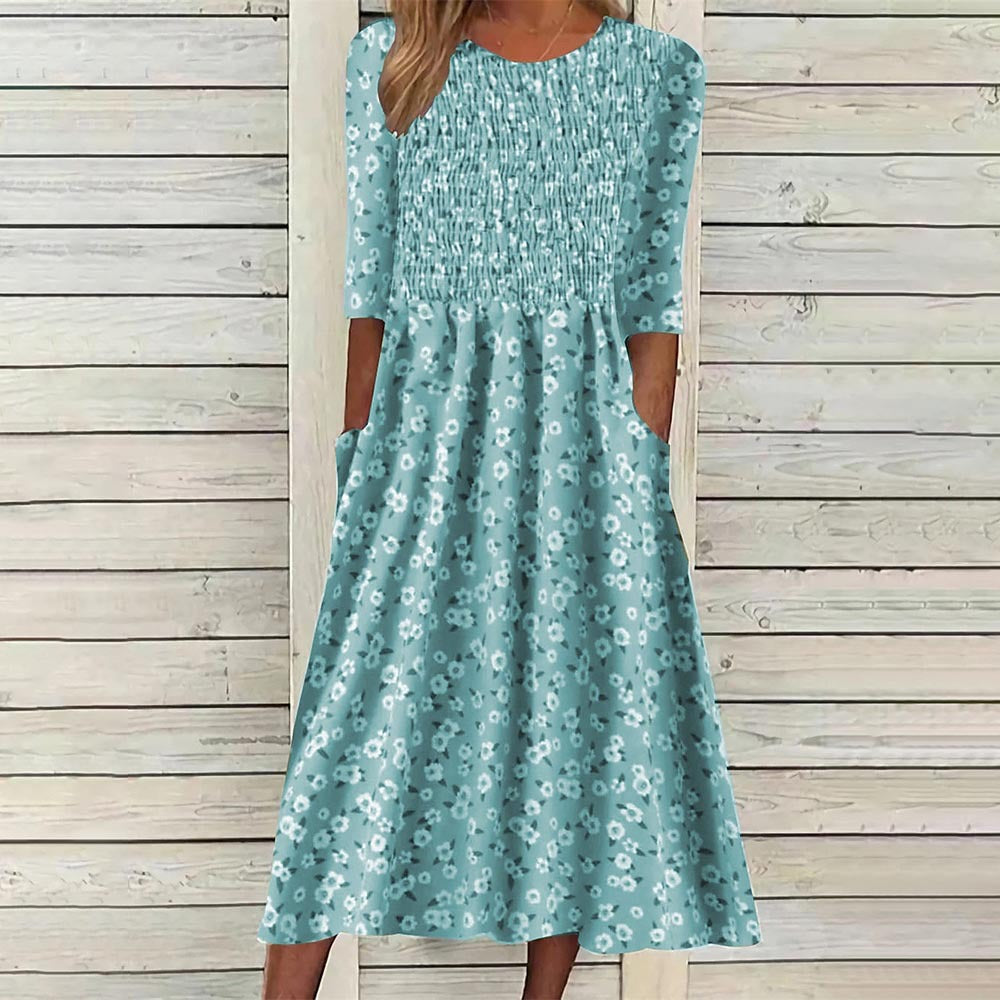 Elegant women's floral midi dress, smocked for comfort & a flattering fit. Ideal for spring and summer wear.