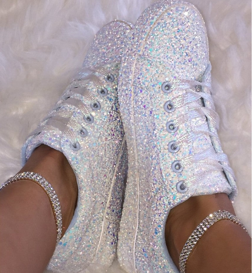 Pair of women's sparkling comfort sneakers, ready for dazzling style. Featuring glitter, breathable sole & casual design.