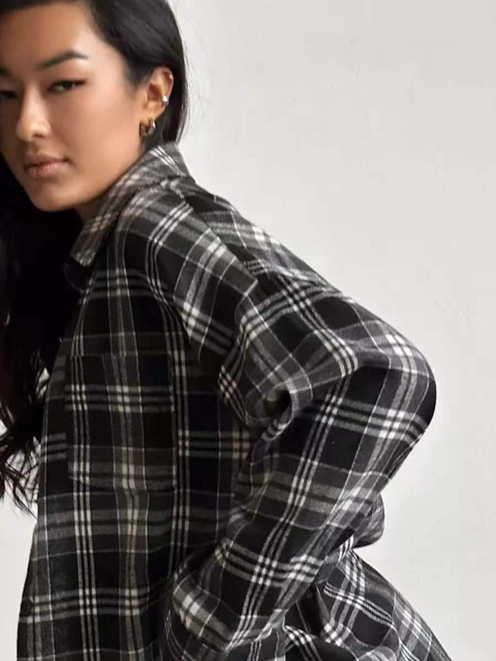 Women's green plaid oversized button-up blouse, relaxed fit, versatile top for a casual chic look.