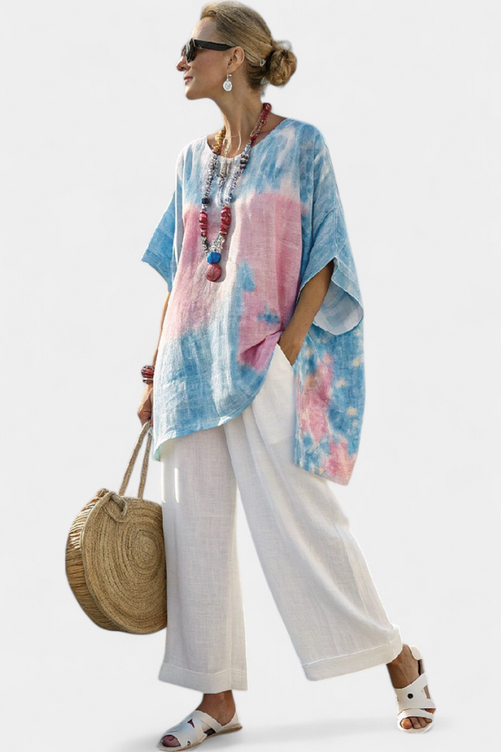 Stylish women's summer two-piece set with a flowing top & striped pants. Effortless, comfortable, and versatile vacation wear.