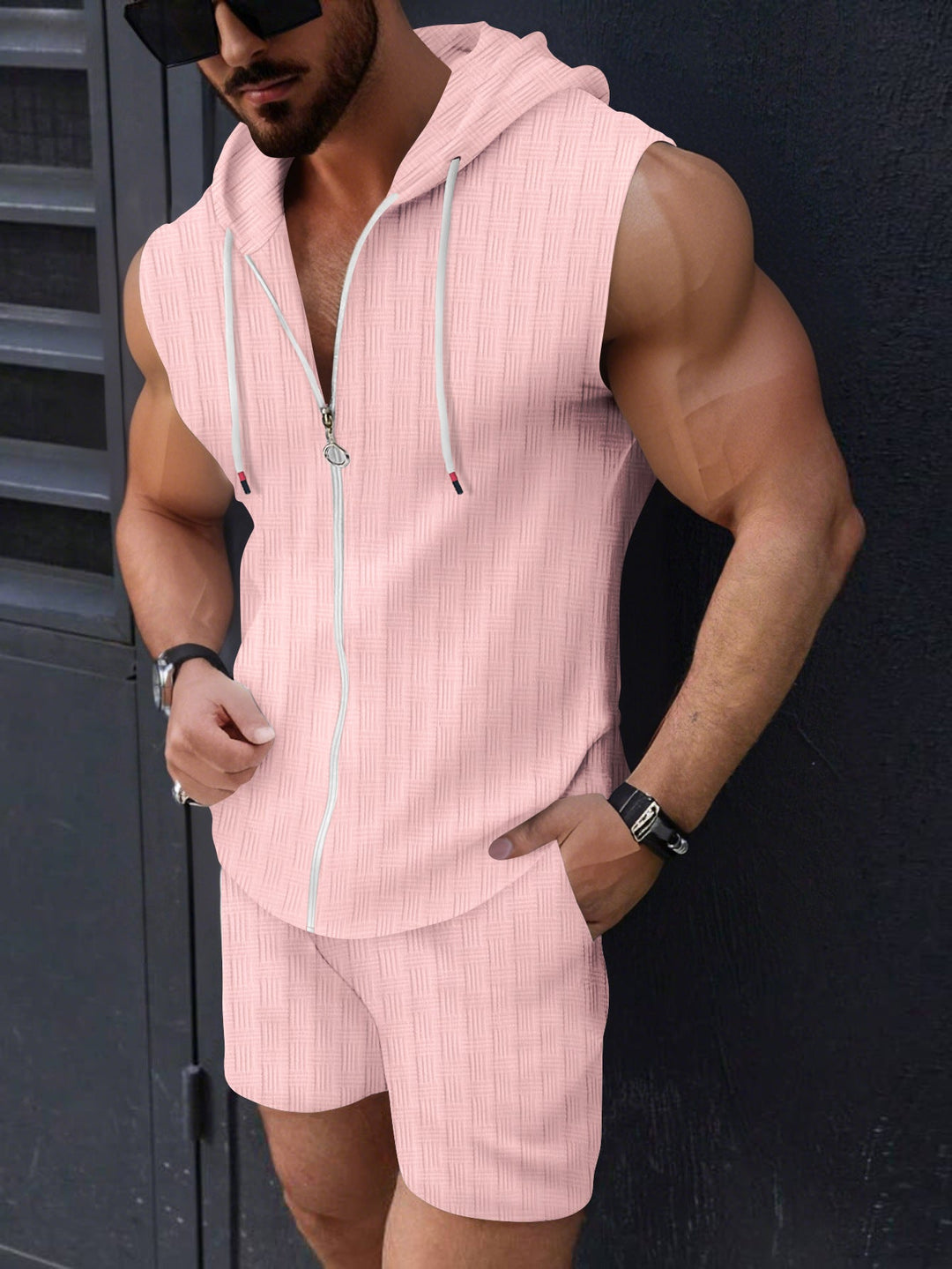 Comfy men's two-piece sleeveless hoodie and sport shorts outfit. Perfect for loungewear.