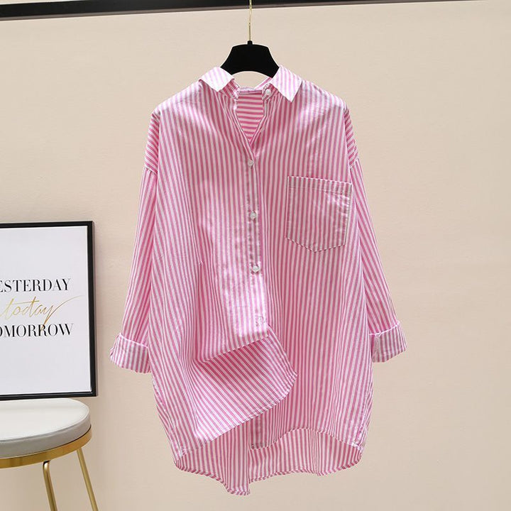 Striped oversized women's top with a distinctive longer back and a single front chest pocket detail.