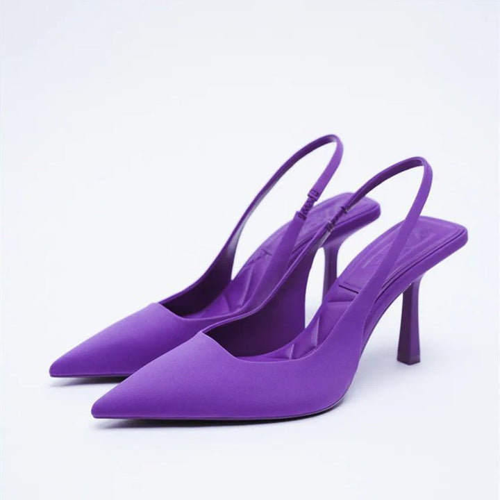 Stylish women's slingback pumps, featuring a unique modern block heel and classic pointed toe.