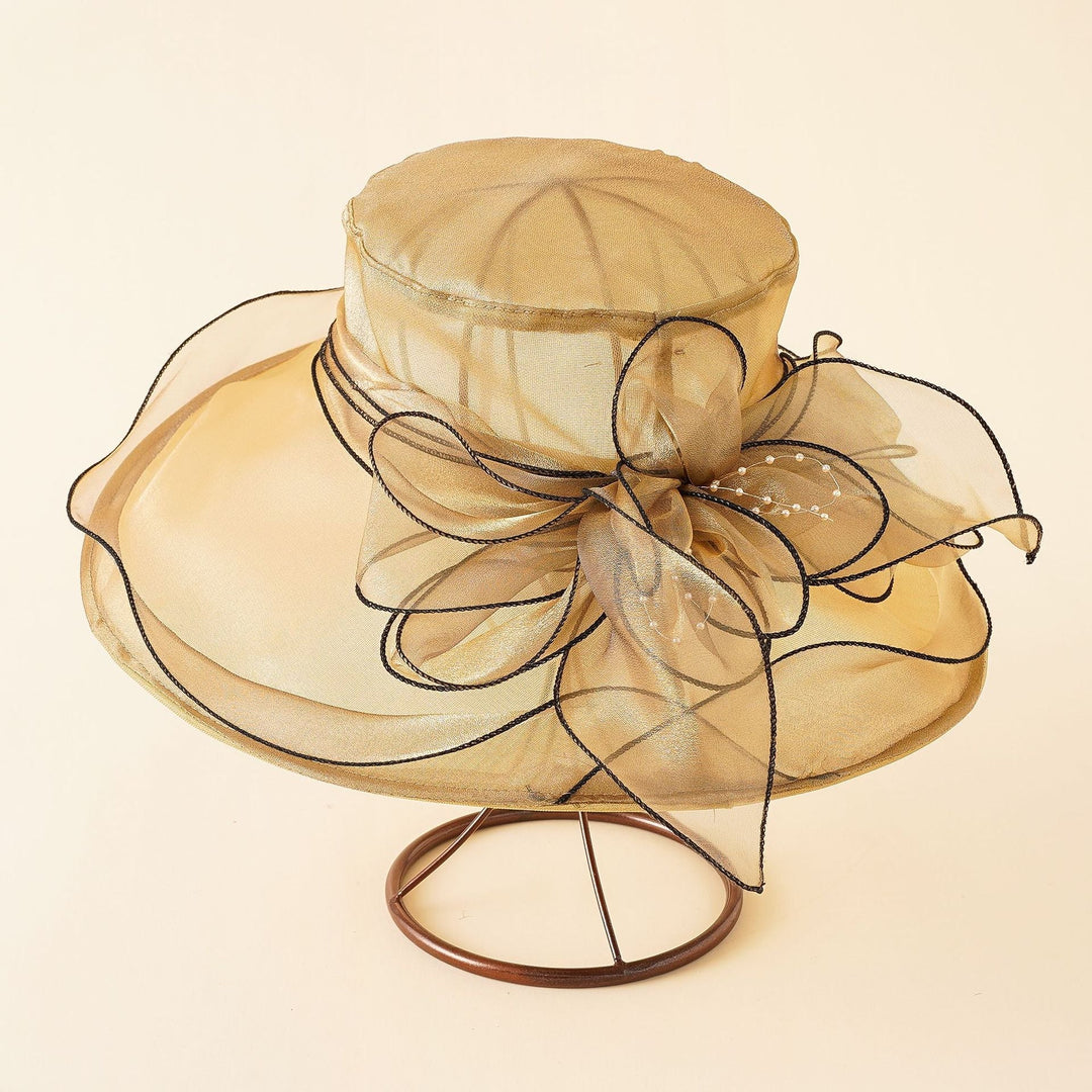 Feminine women's elegant mesh sun hat with a romantic bow, ideal for a refined summer look.