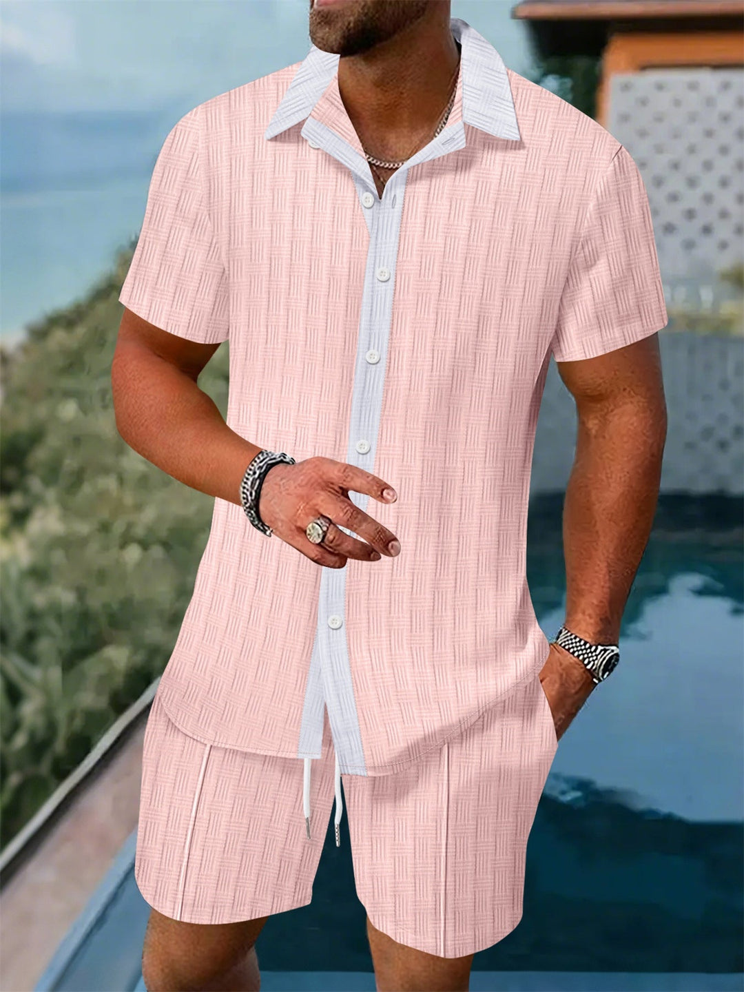 Lightweight men's casual button-up shirt and matching shorts. Stylish two-piece summer leisure outfit.