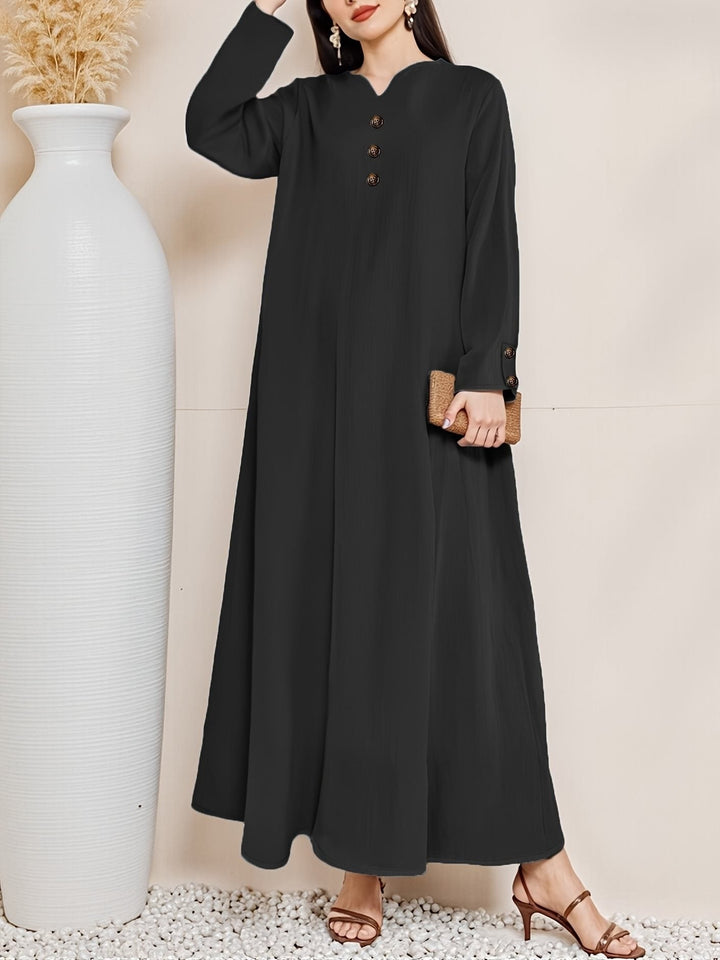 Modern women's elegant button-front maxi dress. A stylish long summer dress suitable for both casual and evening events.
