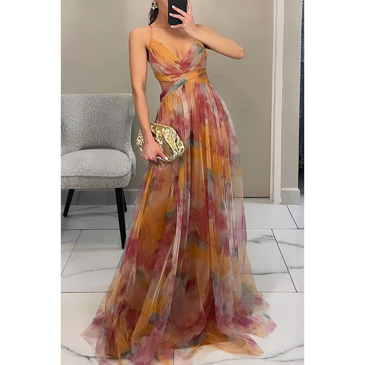 Flowing women's floral maxi dress with elegant V-neck and spaghetti straps, ideal for evening parties.