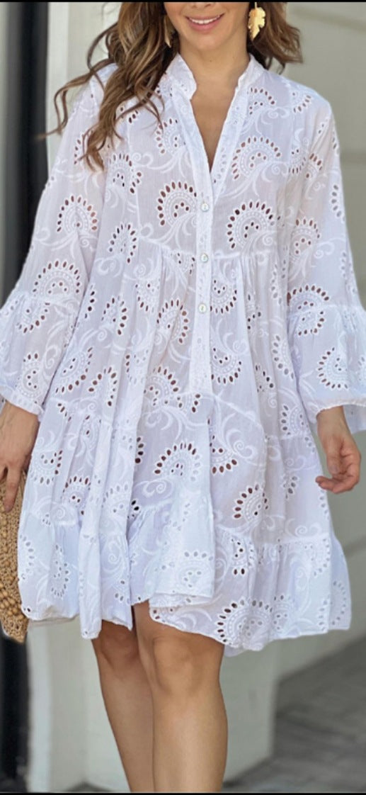Boho style women's tiered mini dress with playful balloon sleeves & flared skirt, ideal for summer parties.