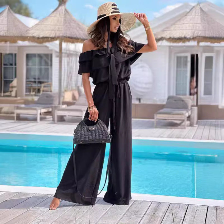 Comfortable women's off-shoulder wide-leg jumpsuit. Chic and elegant style for various occasions. Modern fashion.