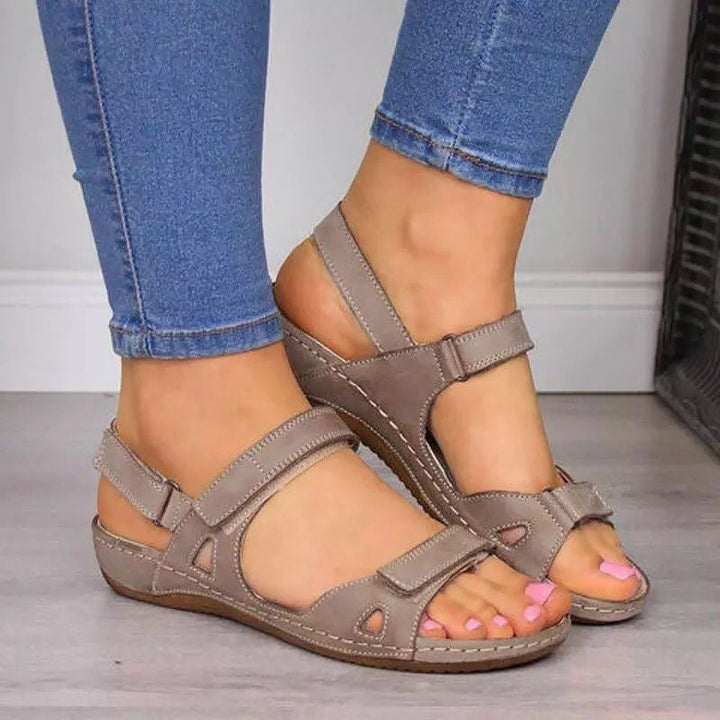 Black ergonomic walking sandals for women, providing excellent arch support & all-day comfort for active wear.