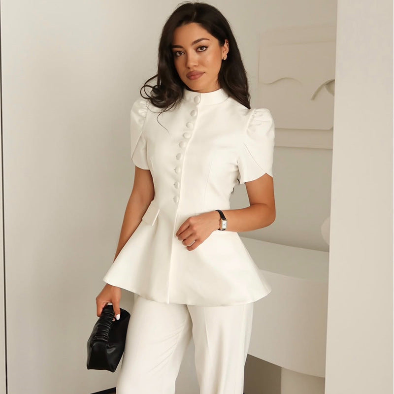 Stylish white women's blazer jacket. Elegant design, voluminous sleeves, & a tailored fit for modern fashion.