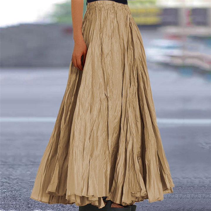 Women's flowing A-line maxi skirt with elastic waist, perfect for casual elegance.