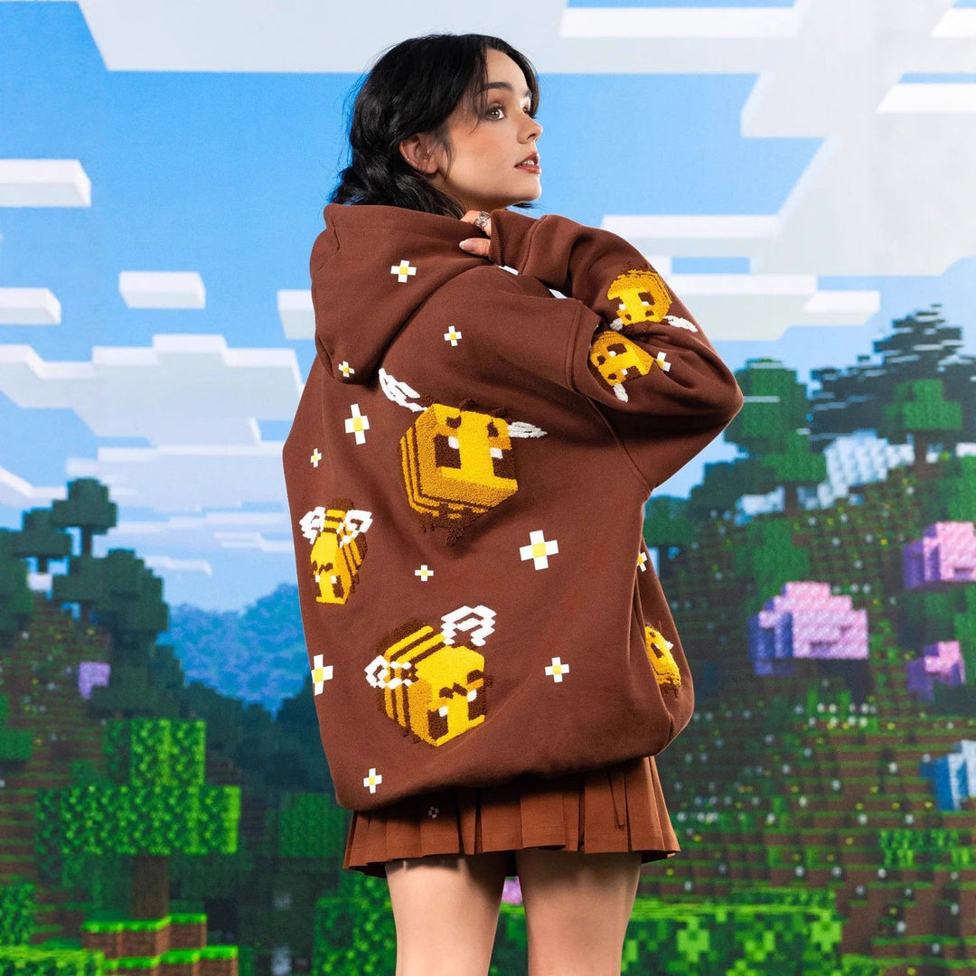 Trendy women's light brown pullover hoodie featuring a relaxed fit and stylish bee design for everyday comfort.
