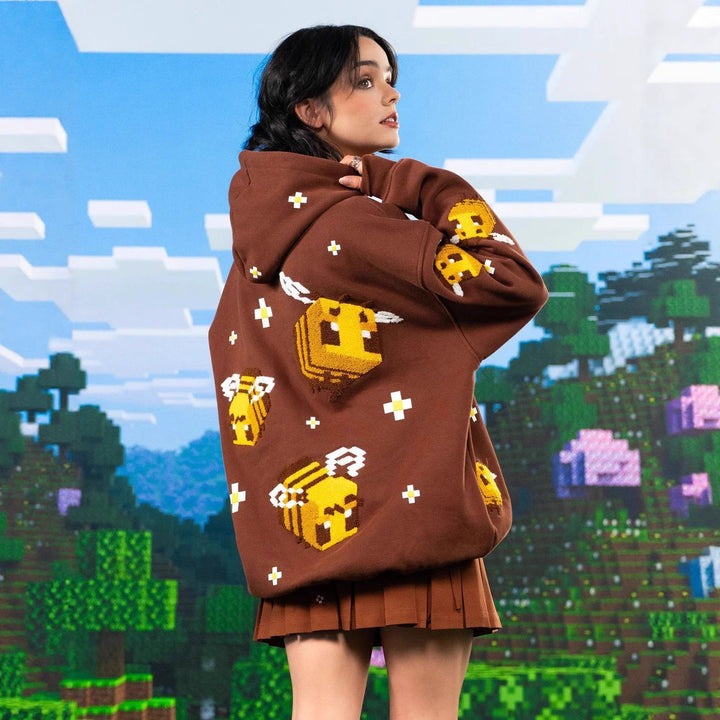 Trendy women's light brown pullover hoodie featuring a relaxed fit and stylish bee design for everyday comfort.